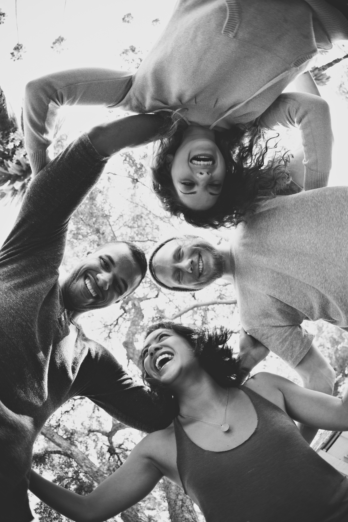teens huddling in black and white